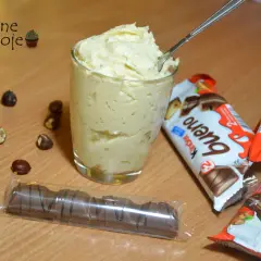 Pyszny krem kinder bueno do tortu, przygotowany z orzechami i batonikami.